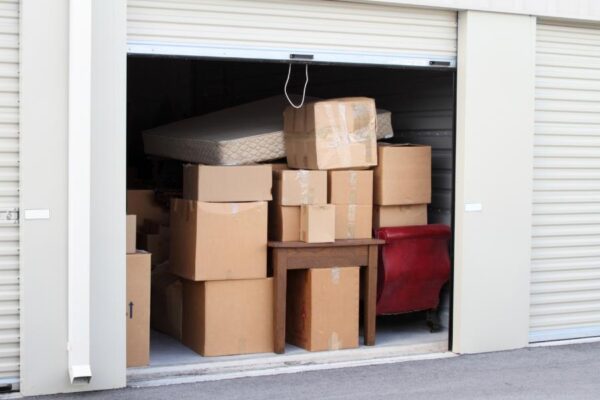 Self storage unit organized with moving boxes