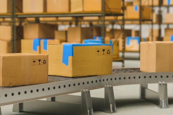 holiday present packages on shipping facility conveyor