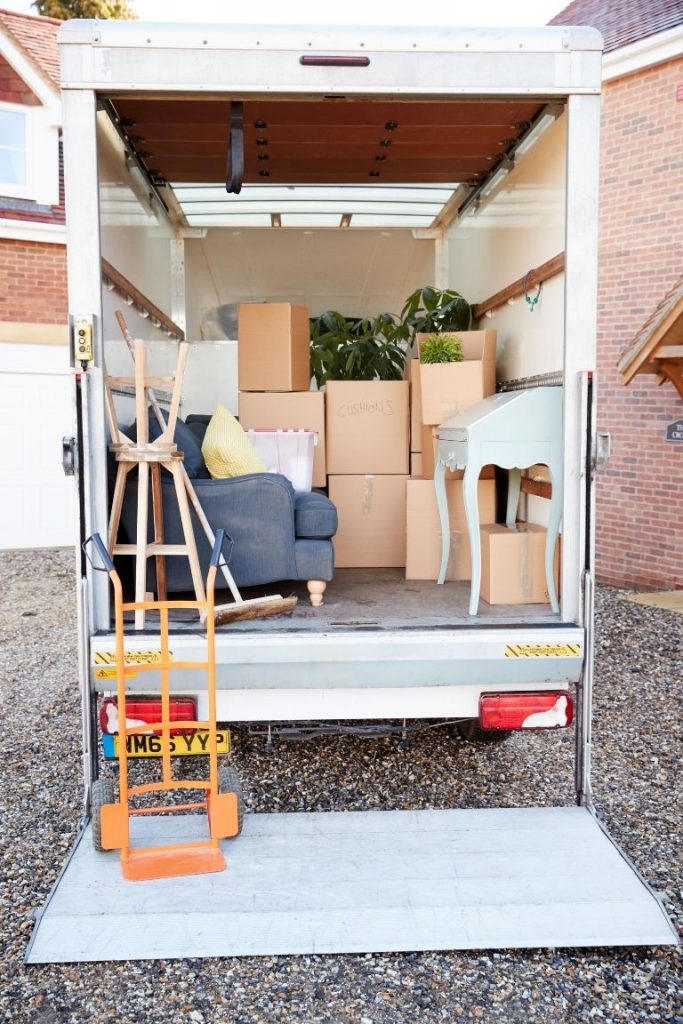 Rear view of a moving truck full of boxes and furniture